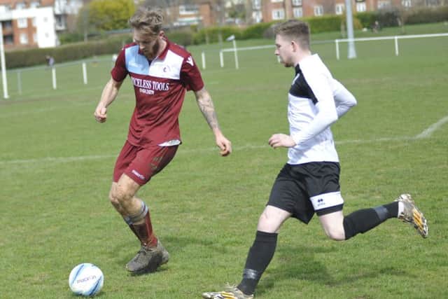 Little Common full-back Ryan Paul gets to the ball just ahead of Bexhill United wide player Corey Wheeler.