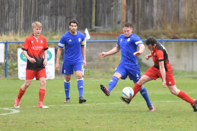 Karly Akehurst cuts out a Hassocks attack. Haywards Heath Town v Hassocks. Picture by Grahame Lehkyj