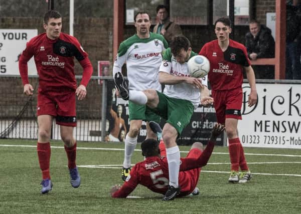 Eastbourne Borough and Bognor battle for possession during their local derby at Priory Lane on Easter Monday