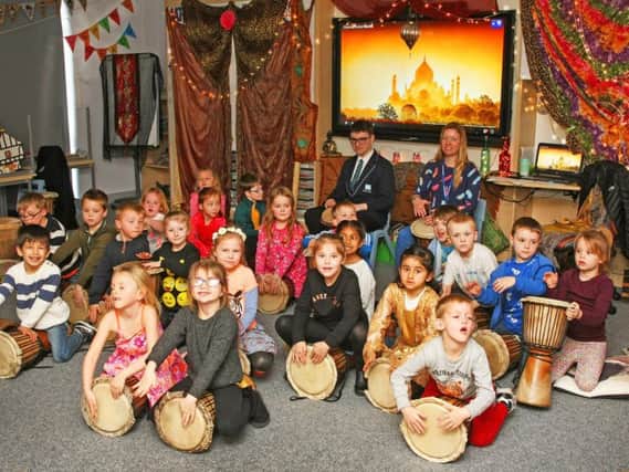 Glebe Primary School pupils practise drumming, Indian style. Picture: Derek Martin DM1833478a