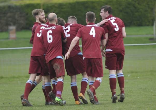 Little Common celebrate their second goal during the Easter Monday victory over Bexhill United.