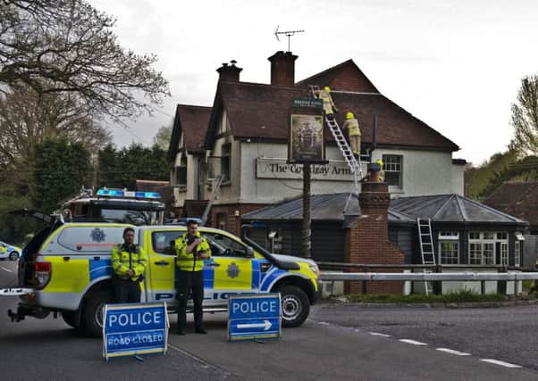 Emergency services at The Cowdray Arms pub in Balcombe on Saturday evening. Picture: Eddie Howland