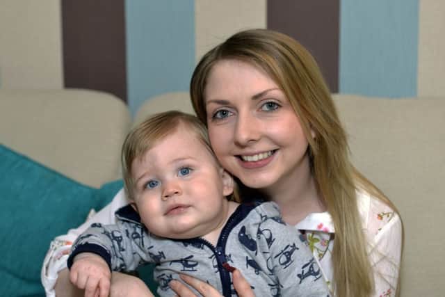 Danielle Saunders and her baby Noah at their home in Hailsham (Photo by Jon Rigby)