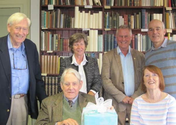 Richard Muir with fellow trustees receiving his leaving gifts at a Trustee Meeting