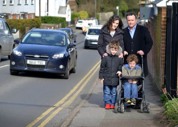 Justin Lay with his wife Nicola and sons Oliver and James on Battle Hill. Picture: Justin Lycett