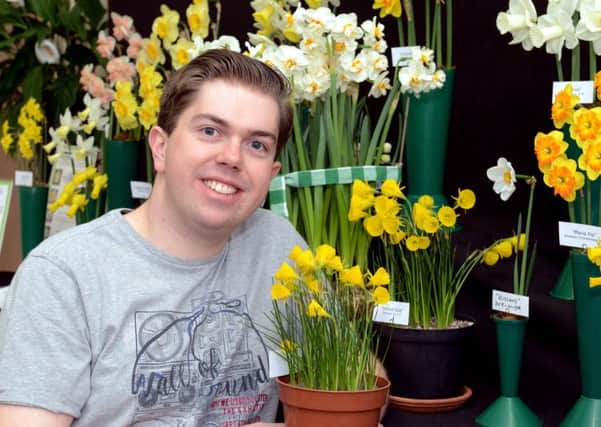 ks180149-1 Chi Southbourne Flower  phot kate Peter Rogers with his daffodil display.ks180149-1 SUS-180804-111302008