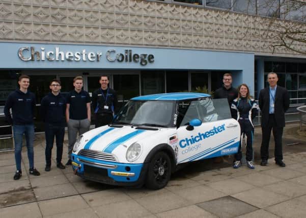 Motorsport students at Chichester College with their racecar
