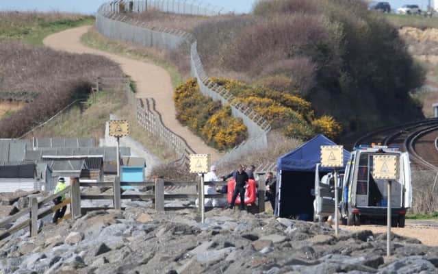 Police have closed off the beach while investigations continue. Photo by Eddie Mitchell. SUS-180504-130426001