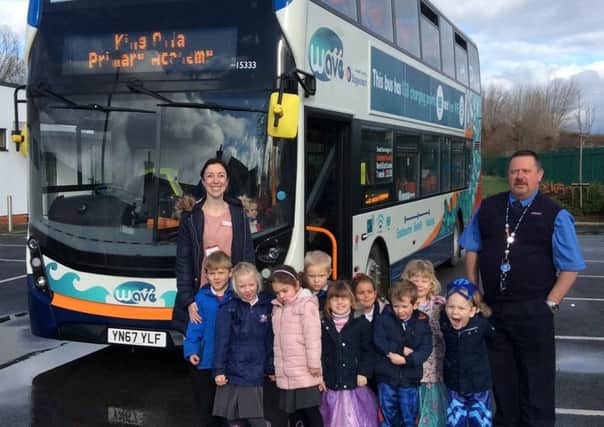 Children from King Offa Primary Academy explore a new Wave bus with Stagecoach Bus driver Phil Laker and teacher Rebecca Winchester. SUS-180220-120548001