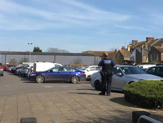 Police officers in the Waitrose car park