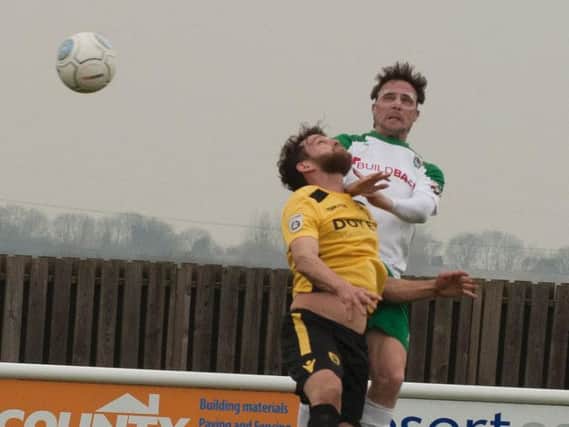 Gary Charman wins an aerial challenge against Gloucester / Picture by Tommy McMillan