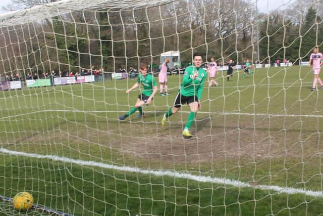 Burgess Hill Town's Connor Tighe celebrates a world class momentagainst Dulwich Hamlet. Picture by Colin Bowman SUS-180804-164817002