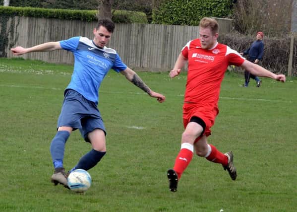 Callum Coker in action for the Robins against Clymping / Picture by Kate Shemilt