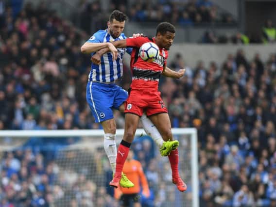 Steve Mounie challenges Albion defender Shane Duffy during Saturday's game. Picture by Phil Westlake (PW Sporting Photography)