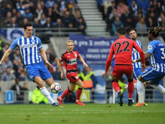 Lewis Dunk on the ball against Huddersfield. Picture by Phil Westlake (PW Sporting Photography)