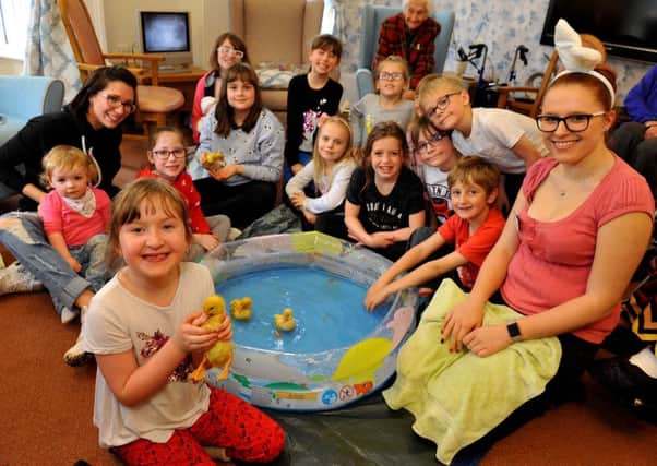 Young carers with ducklings at the Easter event on Monday. Picture: Steve Robards
