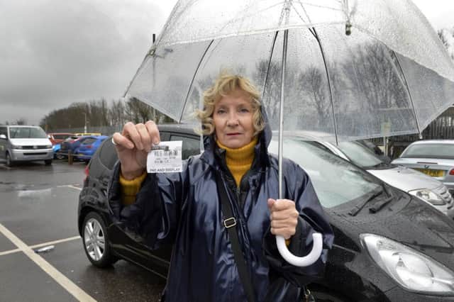 Maggie Pinnell is upset by a parking fine she received when parking at Polegate railway station (Photo by Jon Rigby)