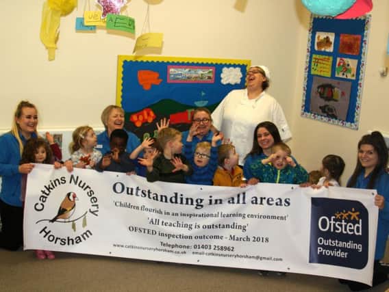 Staff and children at Catkins Nursery celebrate their 'outstanding' result
