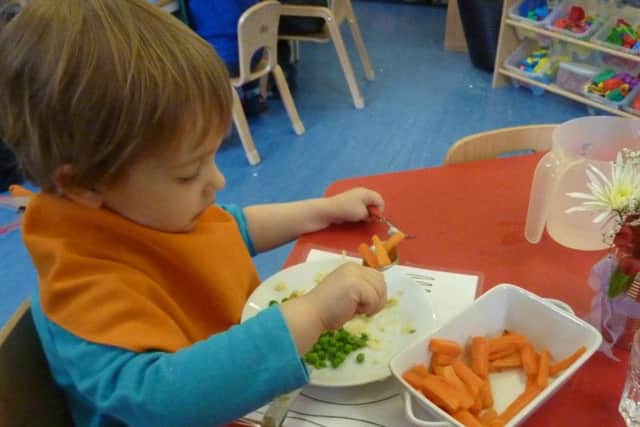 Enjoying a healthy meal at Catkins Nursery