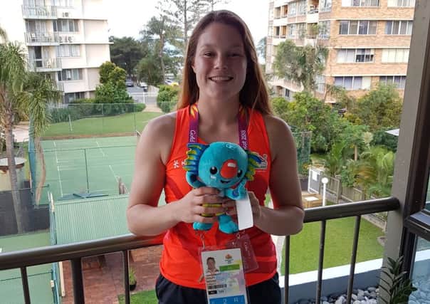 Jess Breach with a Commonwealth Games mascot