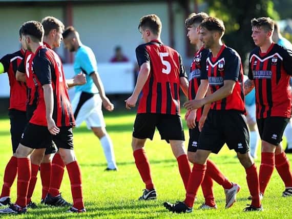 Wick celebrate a goal earlier in the season. Picture by Stephen Goodger