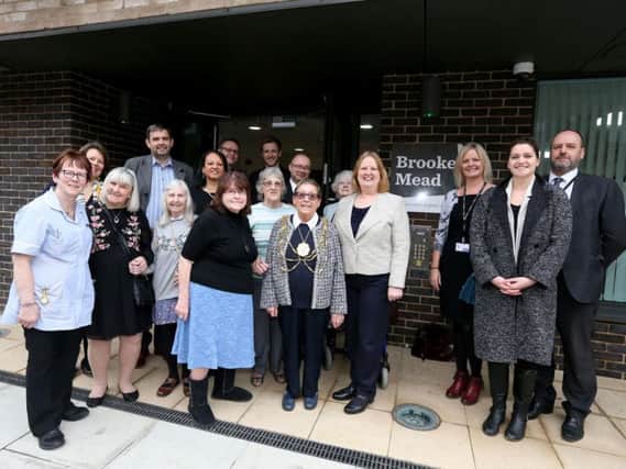 The mayor CllrMo Marsh and Cllr Anne Meadows, chair of the housing and new homes committee, with residents, staff and guests at the opening of Brooke Mead Extra Care scheme