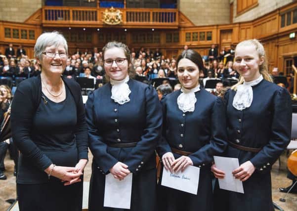Chair of Christ's Hospital Choral Society Liz Lancaster with the Choral Societys annual bursary award winners Katerina, Rebecca and Phoebe SUS-180417-113216001