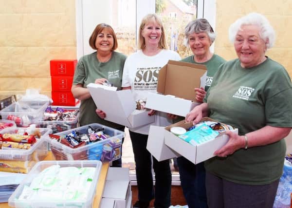 Packing parcels for armed forces serving overseas, Support Our Soldiers volunteers, from left,Penny Keen, Lesley Cunningham. Virginia de Claire and Heather Hodges. Picture: Derek Martin DM1842130a