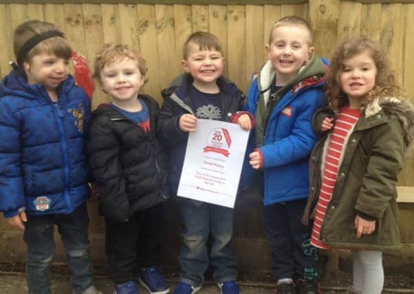 Children at Young Sussex Nursery Shoreham with the award certificate
