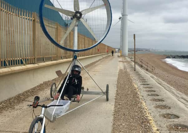 The wind-powered vehicle being put to the test at Shoreham Port, in the shadow of the wind turbines