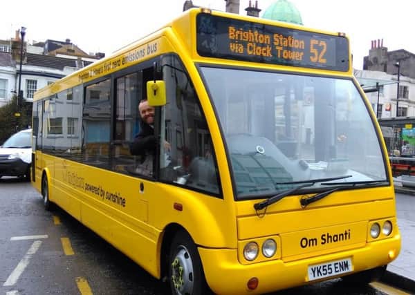 Tom Druitt behind the wheel of one of The Big Lemon's electric buses