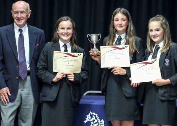Businessman John Harris with competition winners Drew Bevan, Ellie Lossing-Smith and Grace Noakes