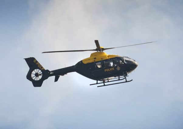 The NPAS helicopter - pictured here on a previous callout - was called to Chichester yesterday