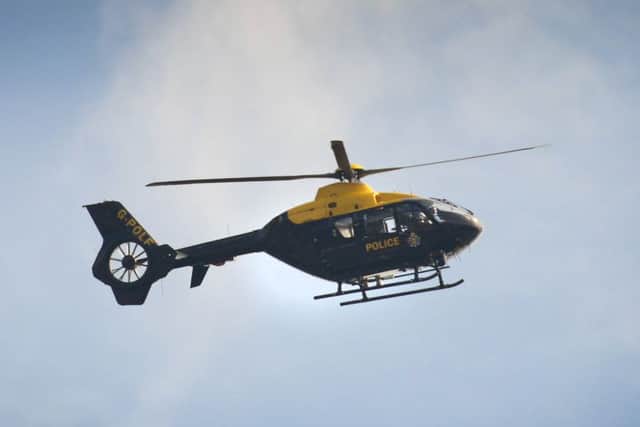 The NPAS helicopter - pictured here on a previous callout - was called to Chichester yesterday
