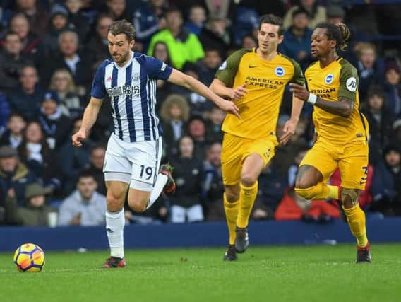 Jay Rodriguez (left) and Gaetan Bong (right) in action during West Brom's match with Brighton in January. Picture by Phil Westlake (PW Sporting Photography)