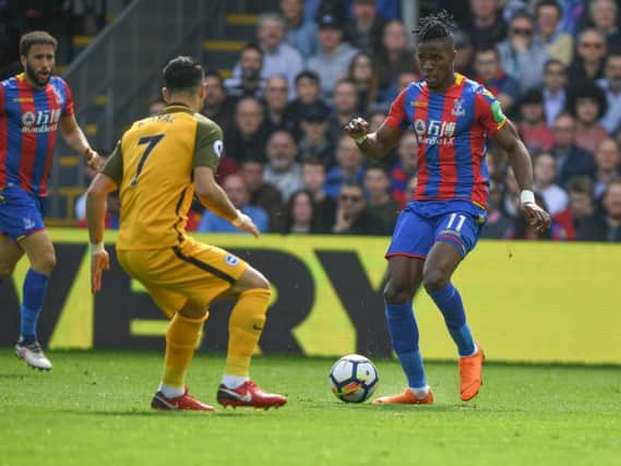Wilfried Zaha takes on Beram Kayal. Picture by Phil Westlake (PW Sporting Photography)