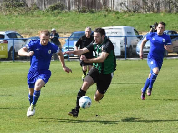 Max Miller shows his pace as he gets away from a defender. Haywards Heath Town v Pagham. Picture by Grahame Lehkyj