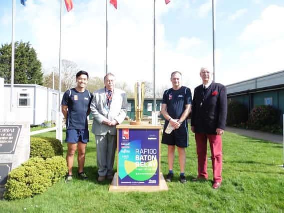Relay runners Kurt Lee and Jay Ferguson with Tangmere Military Aviation Museum chairman David Baron and museum director Dudley Hooley. Photo by Anna Khoo