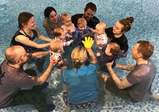 Stephanie Grinstead and Vicky Caldecott run a class for little swimmers