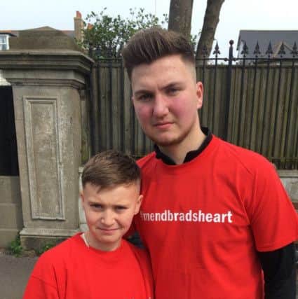 Bradley (right) and younger brother Corey, 11 (left) taken at the Brighton Marathon wearing campaign t shirts