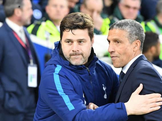 Chris Hughton and Maurico Pochettino embrace on the touchline pre-match. Picture by PW Sporting Photography