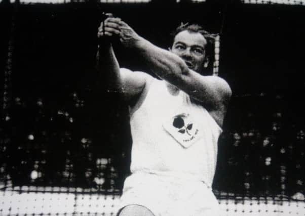 Peter Allday throwing a 16lb Hammer in an England v Finland international match 1958 SUS-180418-103535001