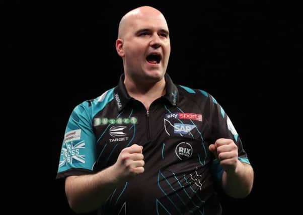 Rob Cross celebrates during his victory over Michael Smith in Sheffield last week. Picture courtesy Lawrence Lustig/PDC