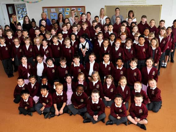 Staff and pupils at St John's Catholic Primary School
