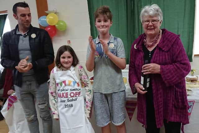 Photo of the four category winners: Gary Richardson (men), Hebe Winstanley (Under 10s), Tavish Vinton-Peters (11-16), and Di Redford (Ladies)