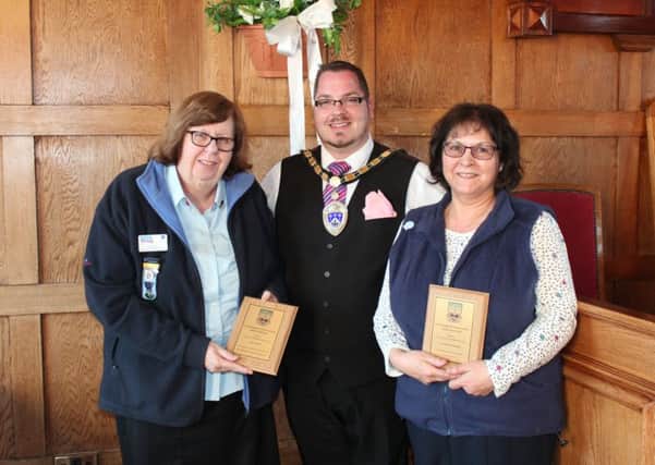 Sue West from the Littlehampton Brownies and Guides group, Littlehampton mayor Billy Blanchard-Cooper and June Caffyn from Shopmobility