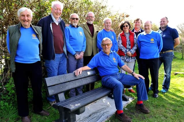 Chanctonbury Lions Centenary bench unveiled at Storrington playpark. Phil Abbott (sitting) with fellow Lions and members of the parish council. Pic Steve Robards SR1810336 SUS-180416-165851001