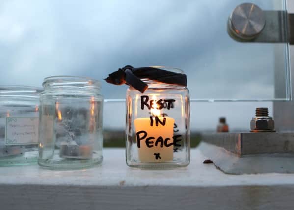 The Bridge of Light in memory of the Shoreham Airshow crash victims. An RIP candle is left