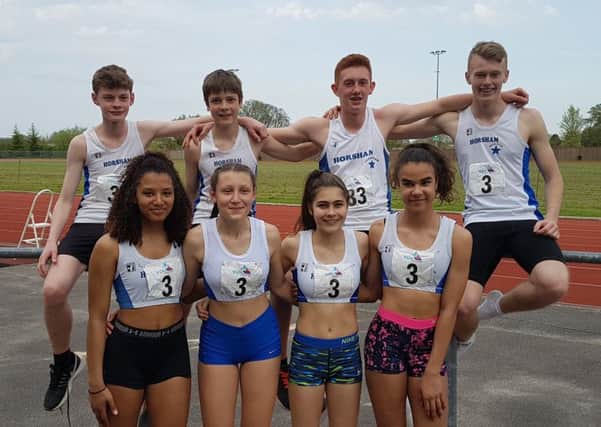 The under-15 boys and girls winning 4x100m squads