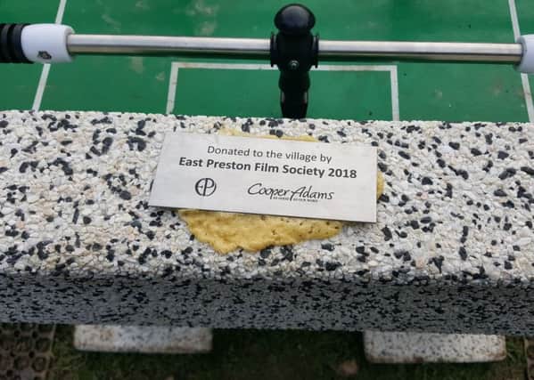 The plaque on the football table in East Preston for Peter Field was taken off and reglued with expanding foam